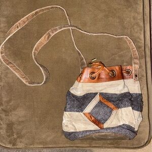 Mona B brown cream and gray striped fabric circular purse with drawstring close